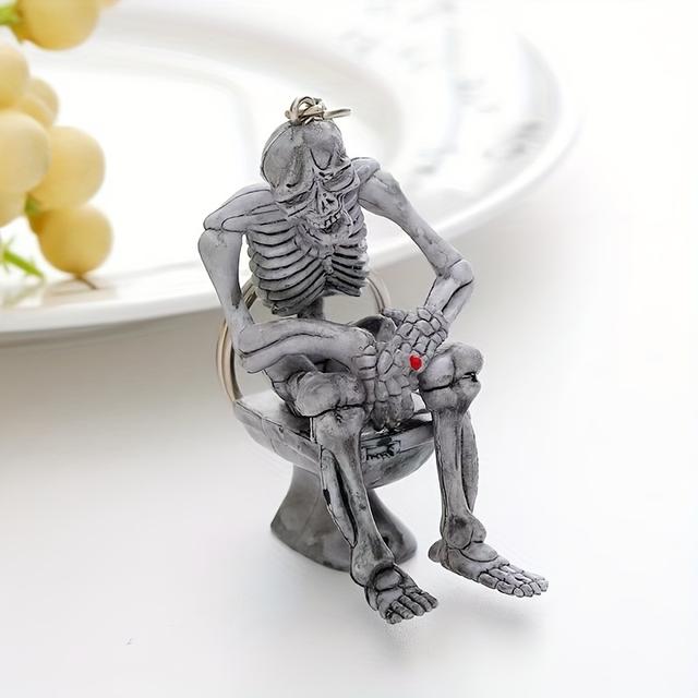 TEMU 1db Újdonság Csontváz WC Kulcstartón - Y2K Inspirációjú, Humoros Fém Kiegészítő Pénztárcákhoz, Hátizsákokhoz, Autókhoz - Egyedi PVC Fejhallgató Tartó Dekor