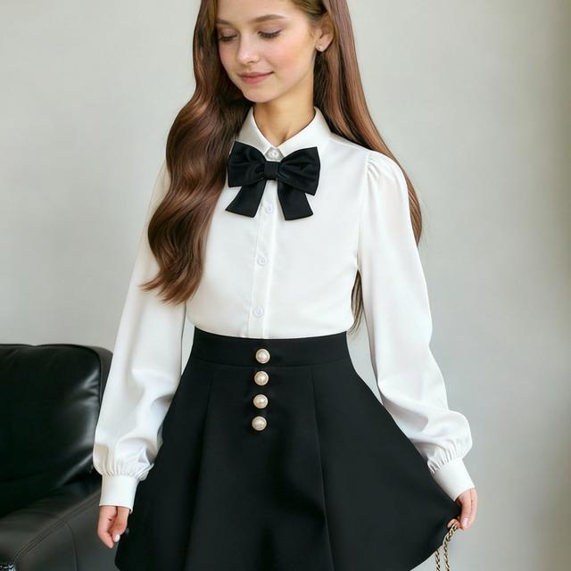 TEMU A Stylish Two-piece Set For Girls Featuring A White Long-sleeve Blouse With A Black Bow Tie And A Black Pleated Skirt With , Perfect For School And Parties